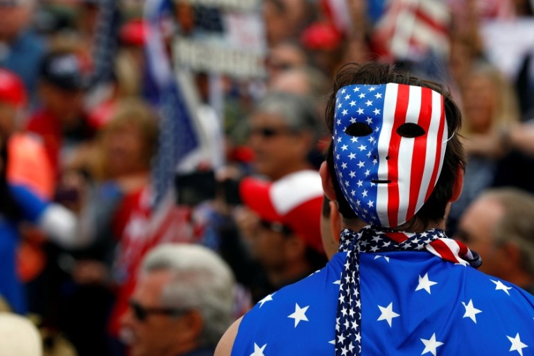 A pro-Trump rally participant wears a U.S.