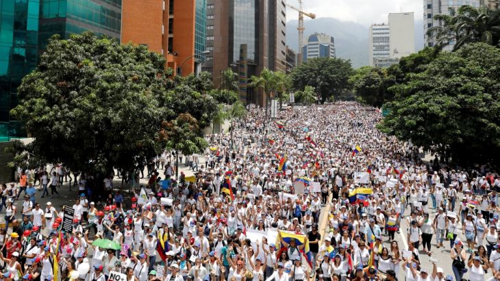 Demonstrators attend a women''s march to protest against President Nicolas Maduro''s government in Caracas,