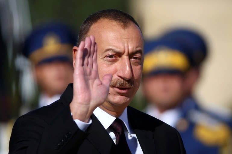 Azerbaijan''s President Ilham Aliyev waves during a meeting with Pope Francis at the Presidential Palace in Ganjlik