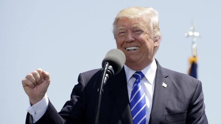 U.S. President Trump pumps his fist and smiles as he delivers commencement address at U.S. Coast Guard Academy in New London