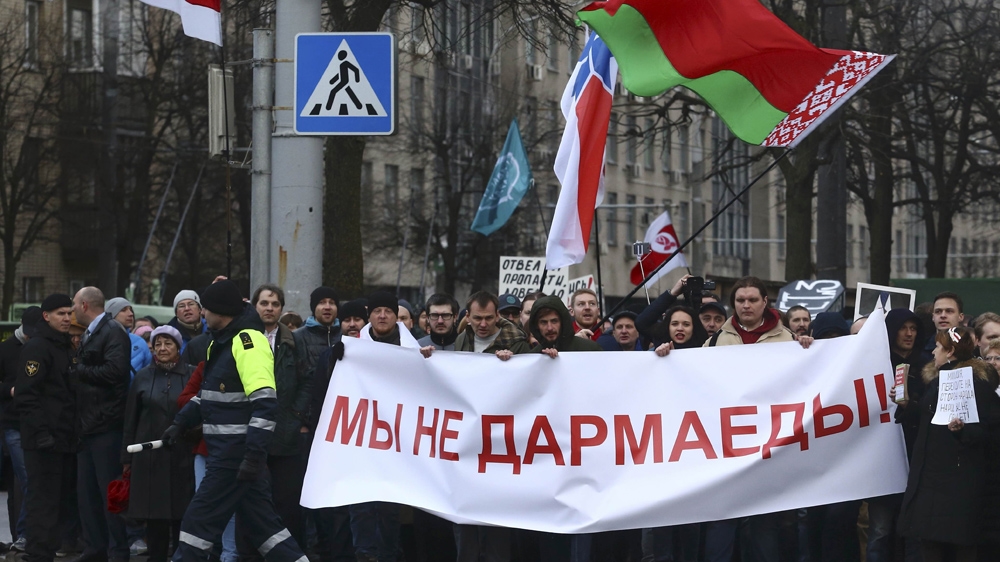 People protest against increased tariffs for communal services and new taxes, including tax for those who are not in full-time employment, in Minsk [Vasily Fedosenko/Reuters]