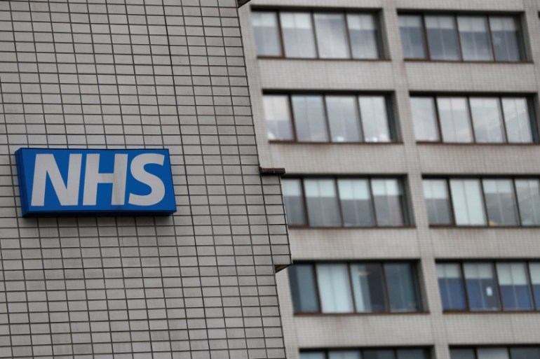 NHS sign is seen at St Thomas'' Hospital in central London