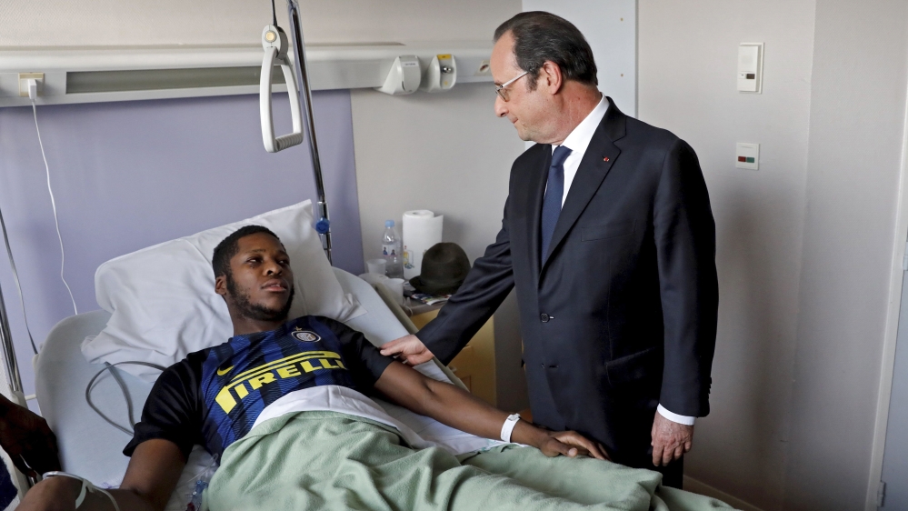 French President Francois Hollande pays a visit to Theo at the Robert Ballanger hospital in Aulnay-sous-Bois [Arnaud Journois/EPA]