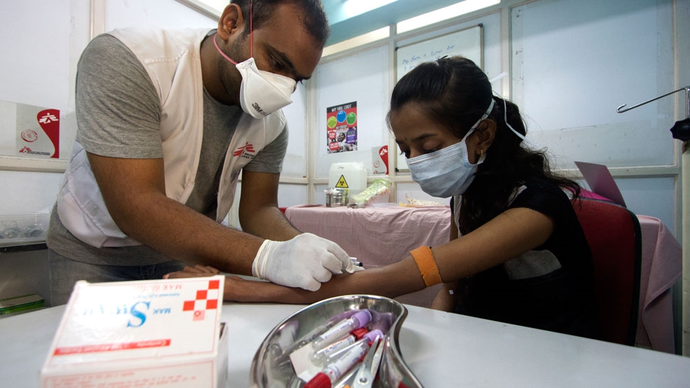 An MSF nurse draws a blood sample from an Extensively-Drug-Resistant Tuberculosis patient [Photo courtesy: MSF]