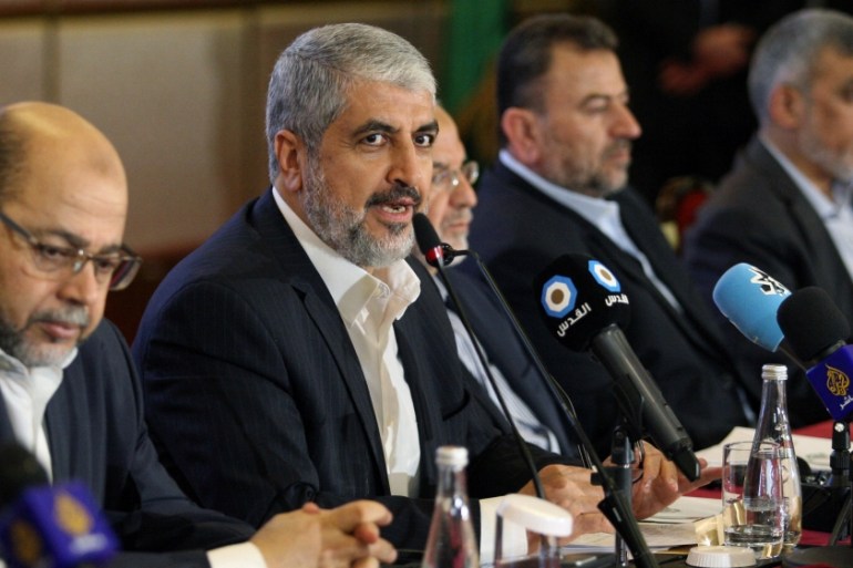 Hamas leader Khaled Meshaal gestures as he announces a new policy document in Doha