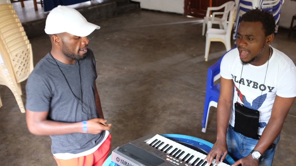 Kibombo, left, jamming at the Alliance francaise institute in Goma [Sruthi Gottipati/Al Jazeera]