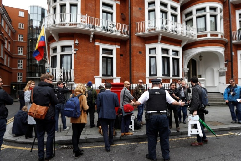 Journalists are seen outside the Ecuadorian embassy in London where WikiLeaks founder Julian Assange is taking refuge