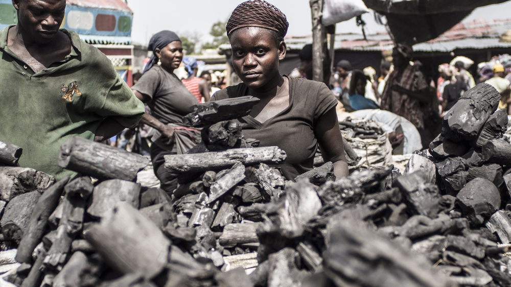 Haitian charcoal vendors at an urban market in Port-au-Prince, Haiti [Jake Kheel]