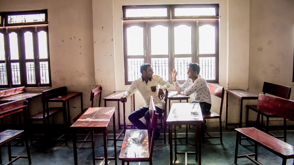 Yogi and his friend Ansh, photographed inside a classroom in their boarding school, Swami Harsewanand Public School, during the winter break, are both pursuing an education with the financial support of yoga instructor Kevin Ryder. [Radhika Iyengar/Al Jazeera]