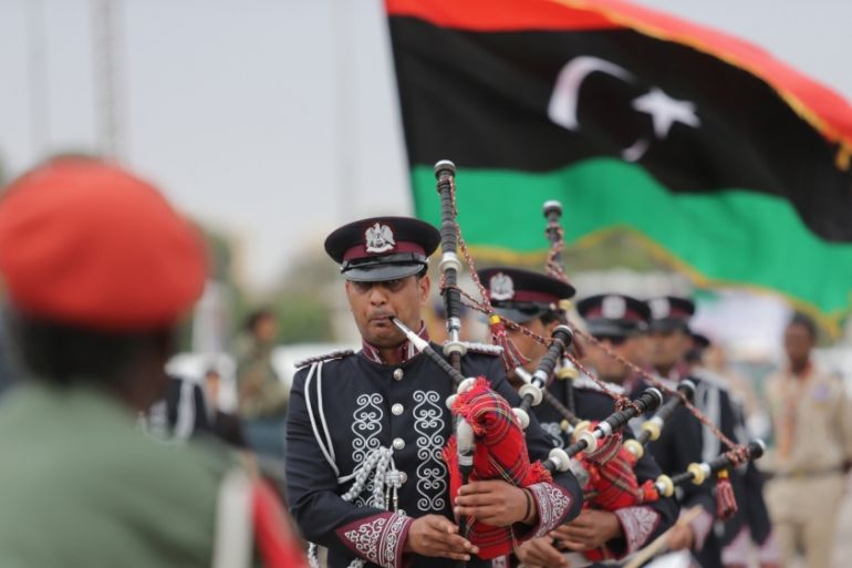 Libyans parade during celebrations marking the third anniversary of Libyan National Army''s ÒDignityÓ operation against Islamists and other opponents, in Benghazi