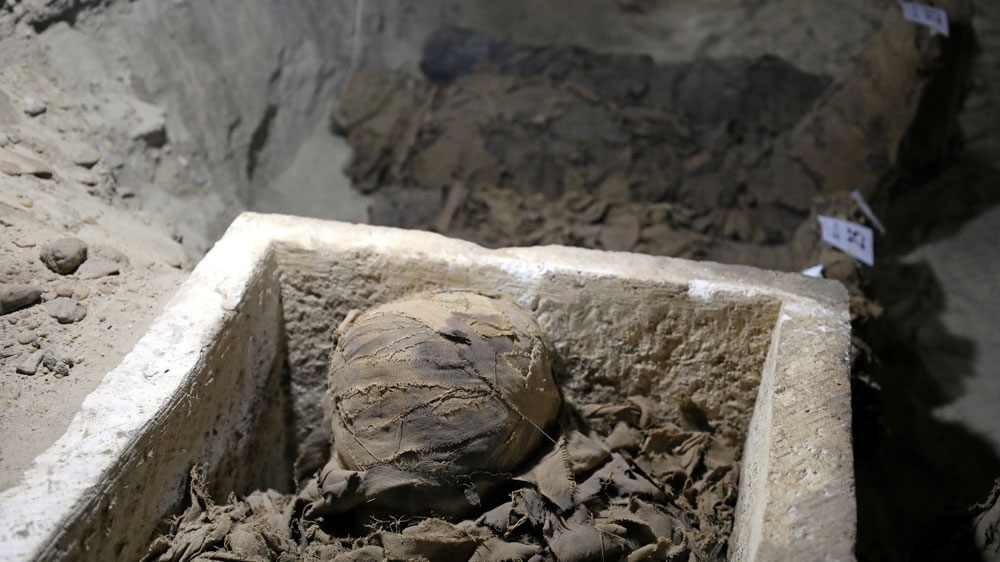 Archaeologists believe there are as many as 32 mummies in the recently discovered necropolis [Mohamed Abd El Ghany/Reuters]