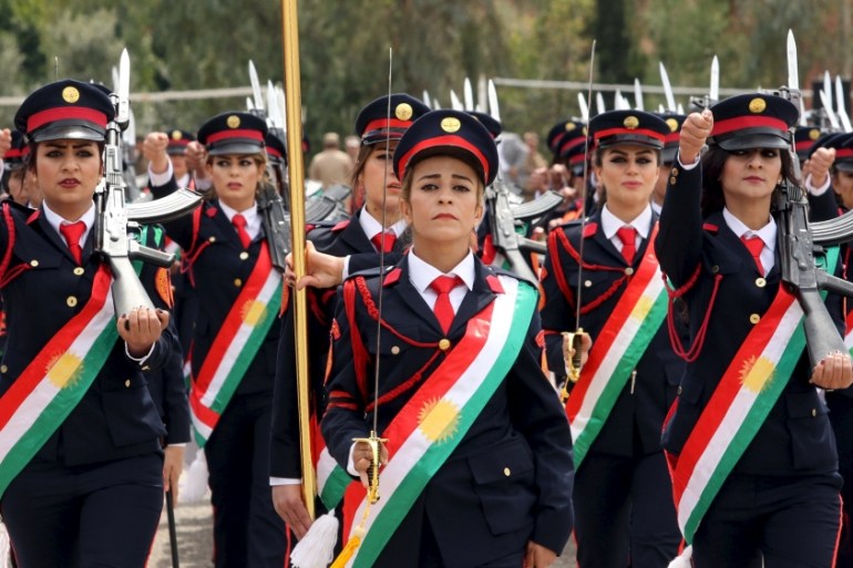 Female Kurdish Peshmerga march during their graduation ceremony at a police academy in Zakho