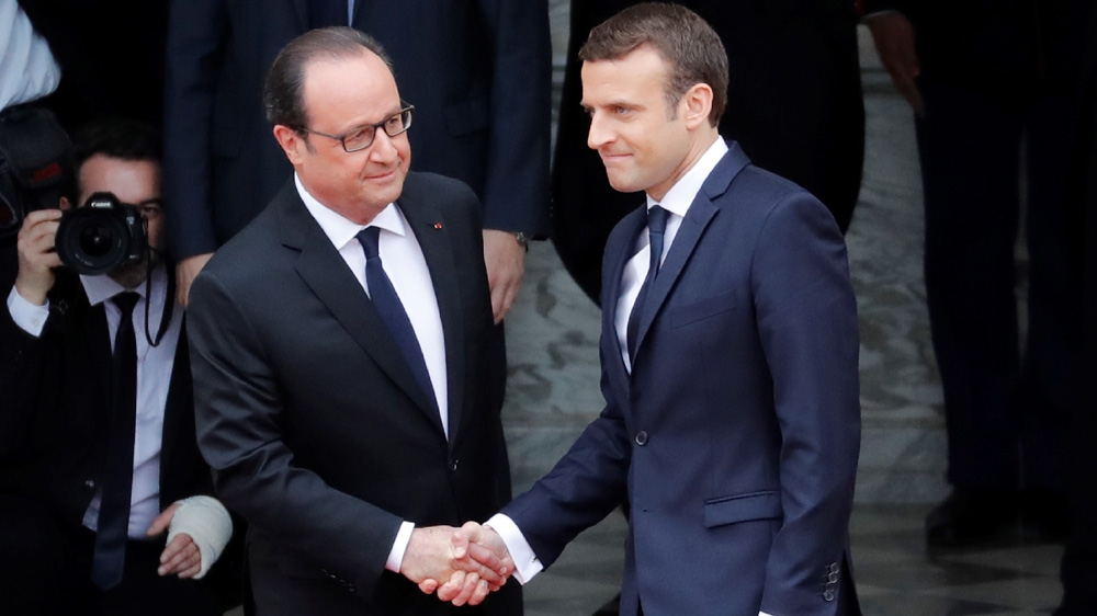 Hollande, left, was increasingly unpopular towards the end of his presidency and did not run in the 2017 election [AFP]