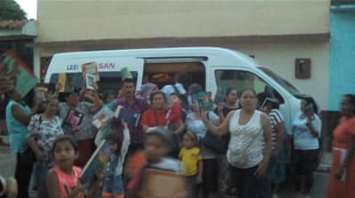 The family have converted a donated old ambulance into a mobile library [Image courtesy of Jose Alberto Gutierrez]