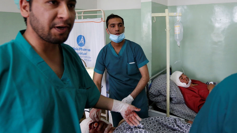 Injured men received treatment at a hospital after the suicide attack [Mohammad Ismail/Reuters]