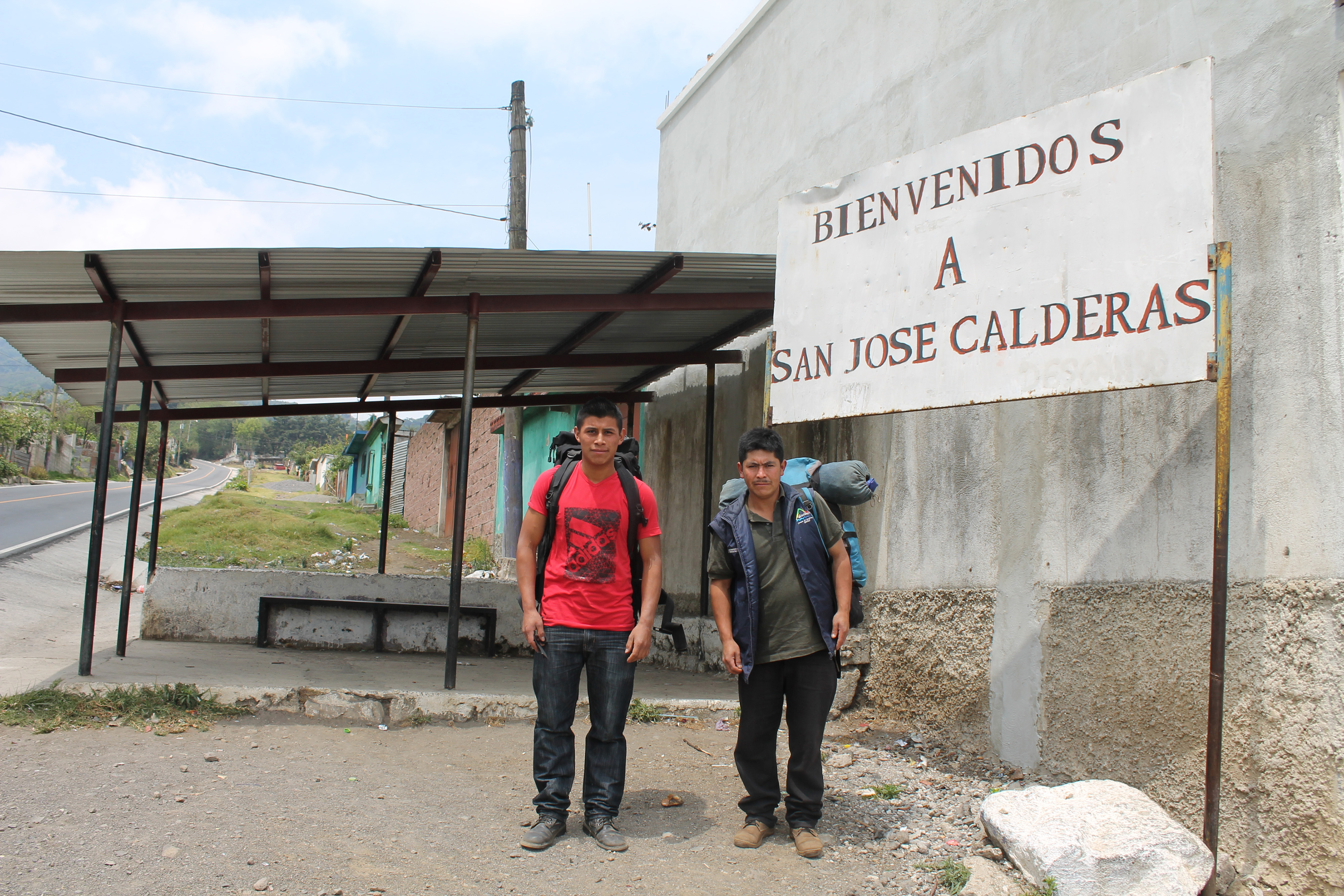 Two Aprode guides wait for tourists to arrive on the highway that leads to Acatenango [Martha Pskowski/Al Jazeera]