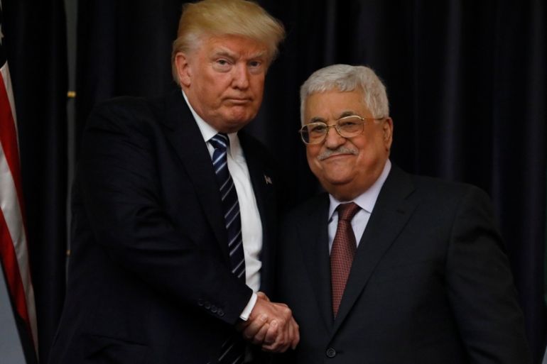 Trump and Abbas shake hands as they conclude their remarks after their meeting at the Presidential Palace in the West Bank city of Bethlehem