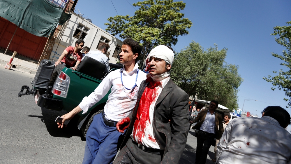 A wounded man arrives at a hospital after the powerful blast in Kabul [Mohammad Ismail/Reuters]