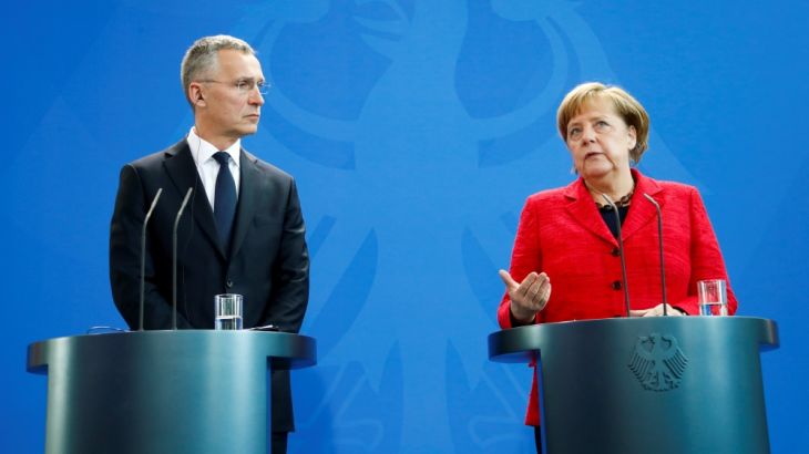 NATO Secretary-General Jens Stoltenberg and German Chancellor Angela Merkel address a news conference following their talks in Berlin