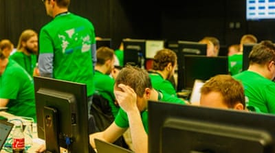 The Green Team, in charge of the physical and online infrastructure of Locked Shields [Jose Miguel Calatayud/Al Jazeera]