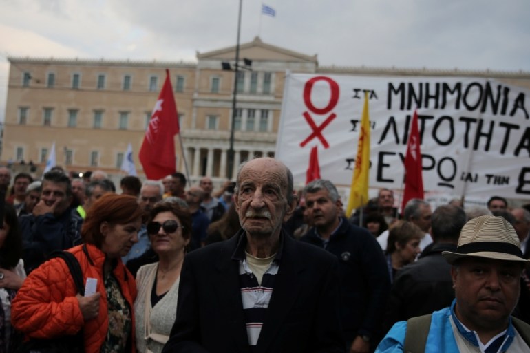 Demonstrators are gathered outside the parliament building as Greek lawmakers vote on the latest round of austerity Greece has agreed with its lenders, in Athens