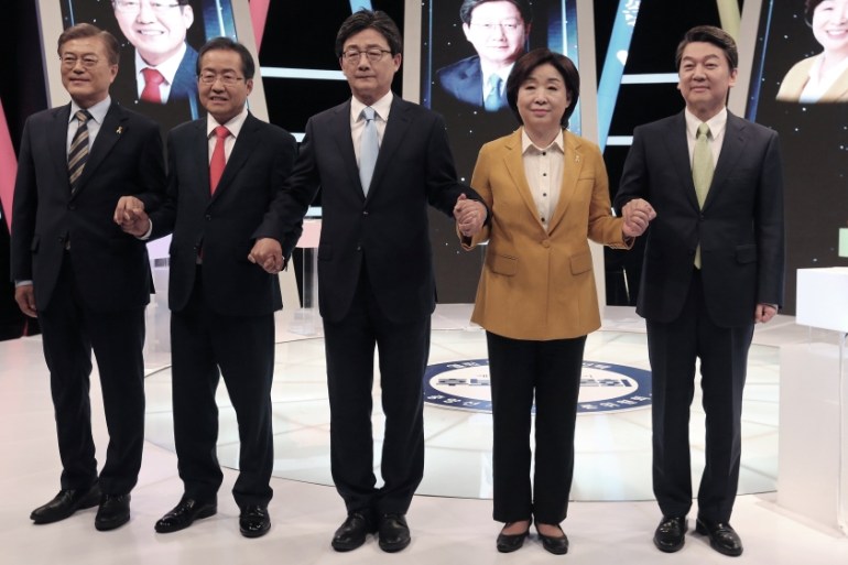 South Korean presidential election candidates pose before a debate in Seoul