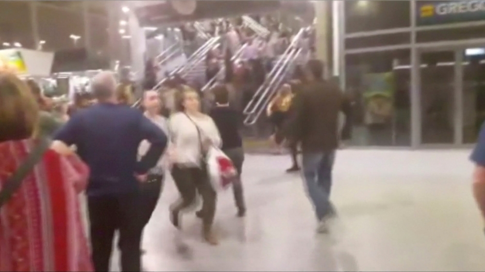 People running down stairs as they attempt to exit the Manchester Arena after the blast [Reuters]