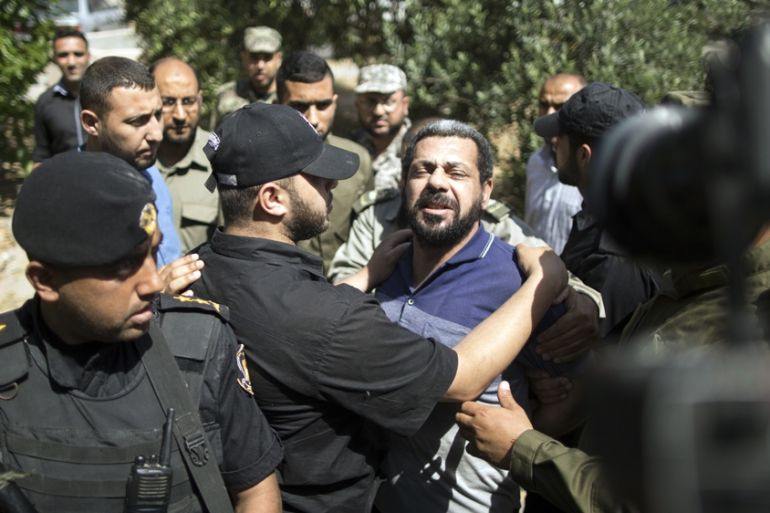 Hamas security forces escort Hisham al-Aloul