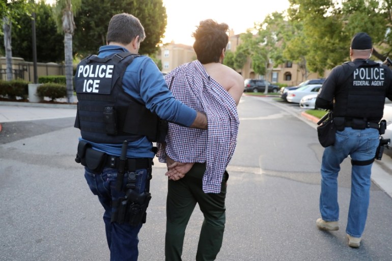 The Wider Image: ICE arrests immigrant