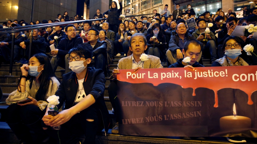 Members of the Chinese community attend a protest at Place de la Bastille after police killed Shaoyo Liu [Charles Platiau/Reuters]