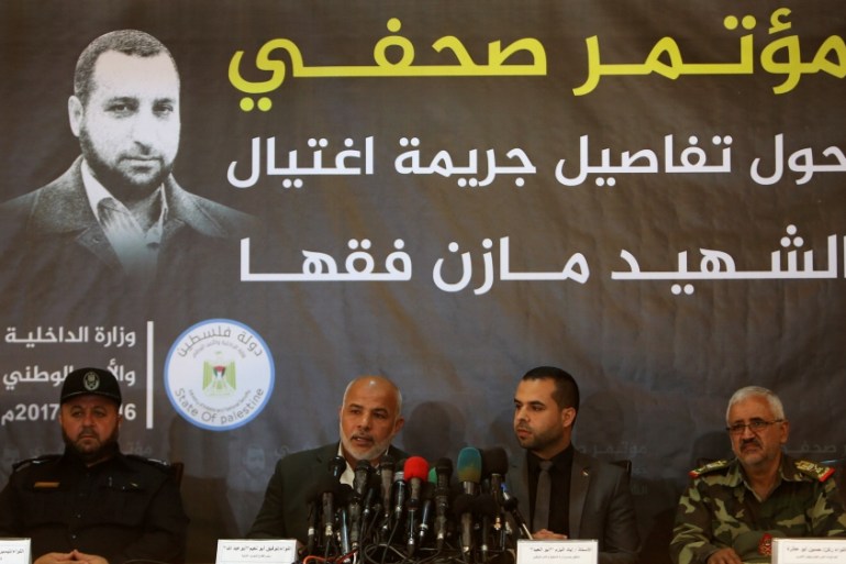 Tawfiq Abu Naeem (2nd L), head of Hamas-run security forces in Gaza, speaks during a news conference disclosing details on the killing of senior commander Mazen Fuqaha, in Gaza City