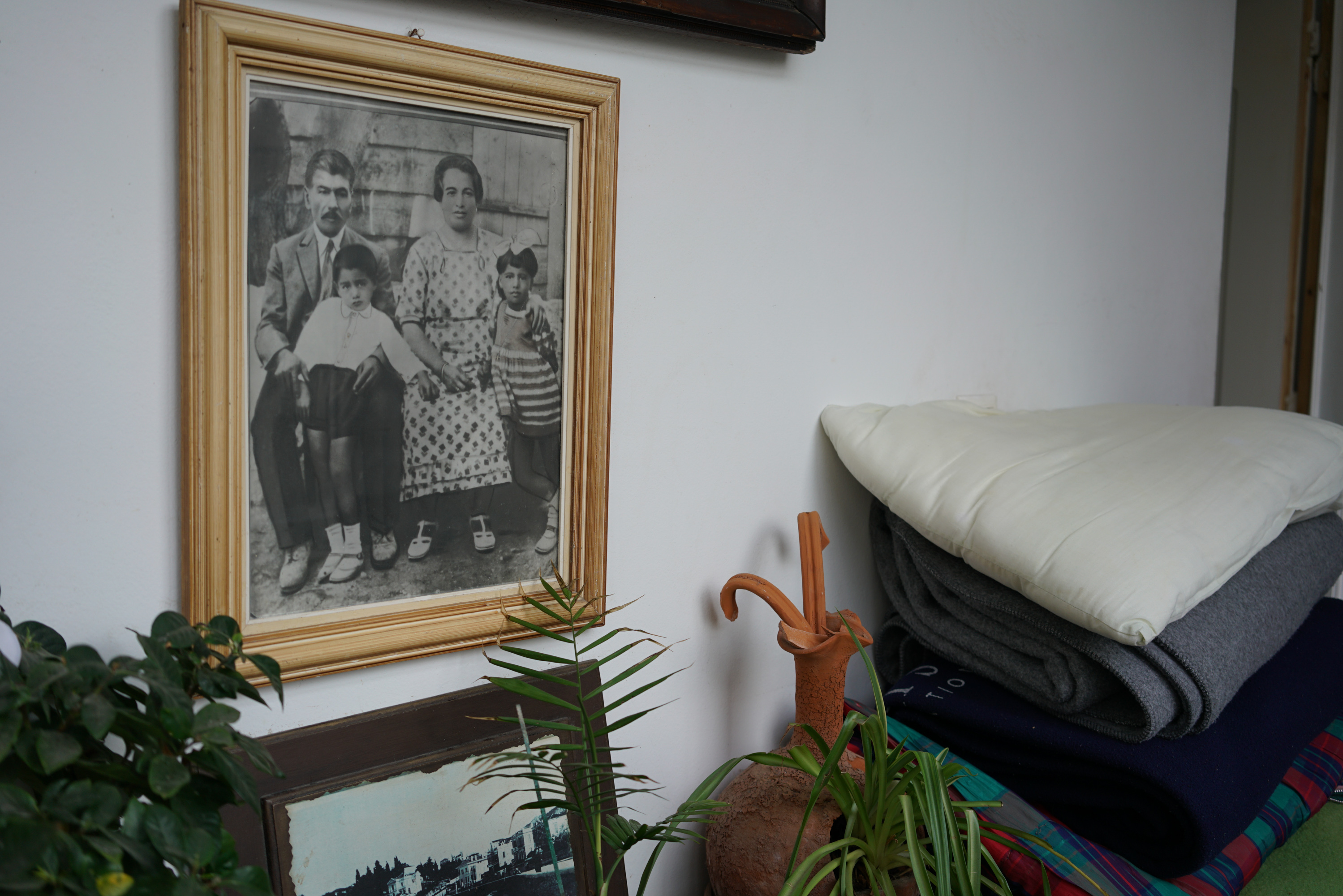 A family portrait of the Makris family from 1938: Dimitrios's grandparents Efthimios and Stratigoula Makris with their son Dimitrios and daughter Akindinoula. [Talitha Brauer/Al Jazeera]