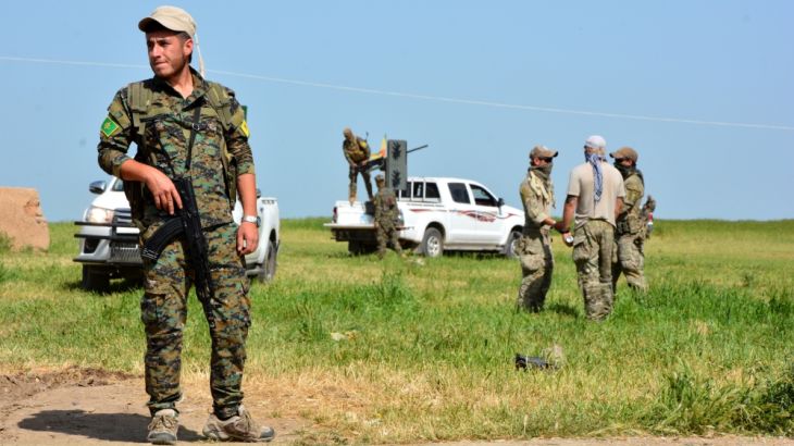 The Kurdish YPG militia and US military units patrol the Syrian-Turkish border