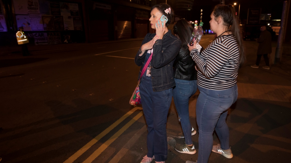 Concert-goers react after fleeing the Manchester Arena [Jon Super/Reuters] 