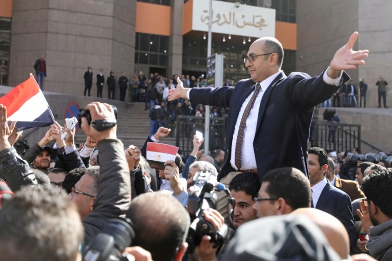 Ali reacts in front of the State Council courthouse in Cairo