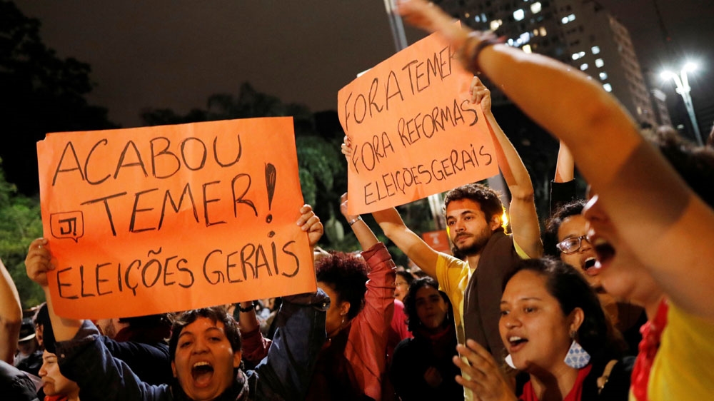 Demonstrators protest against Brazil's President Michel Temer in Sao Paulo [Nacho Doce/Reuters]
