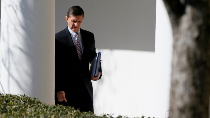 FILE PHOTO - White House National Security Advisor Flynn walks down the White House colonnade on the way to Abe and Trump joint news conference at the White House in Washington
