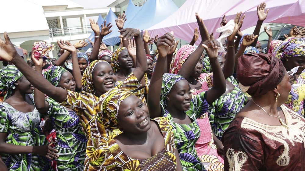 Scenes of joy as 82 girls freed by Boko Haram reunite with their parents [Sunday Aghaeze/AFP]