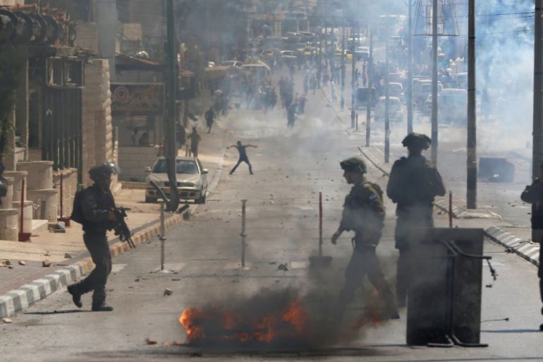 Palestinian protesters clash with Israeli troops following a protest in the West Bank town of Bethlehem