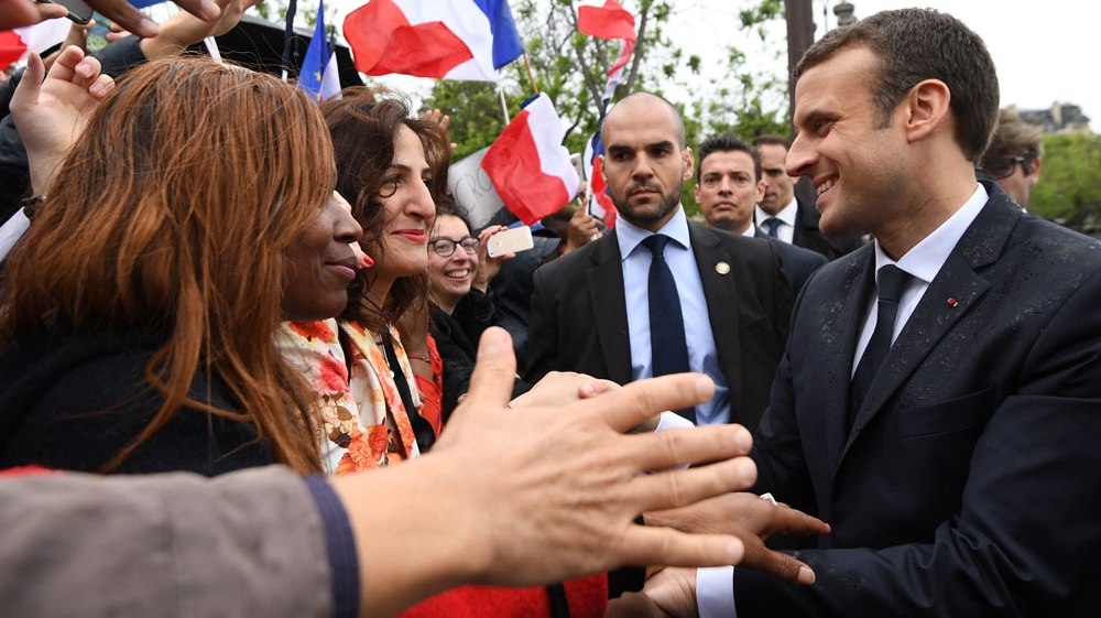  Macron greets supporters after a ceremony at the Arc of Triomphe following his formal inauguration ceremony as French President [Alain Jocard/AP]