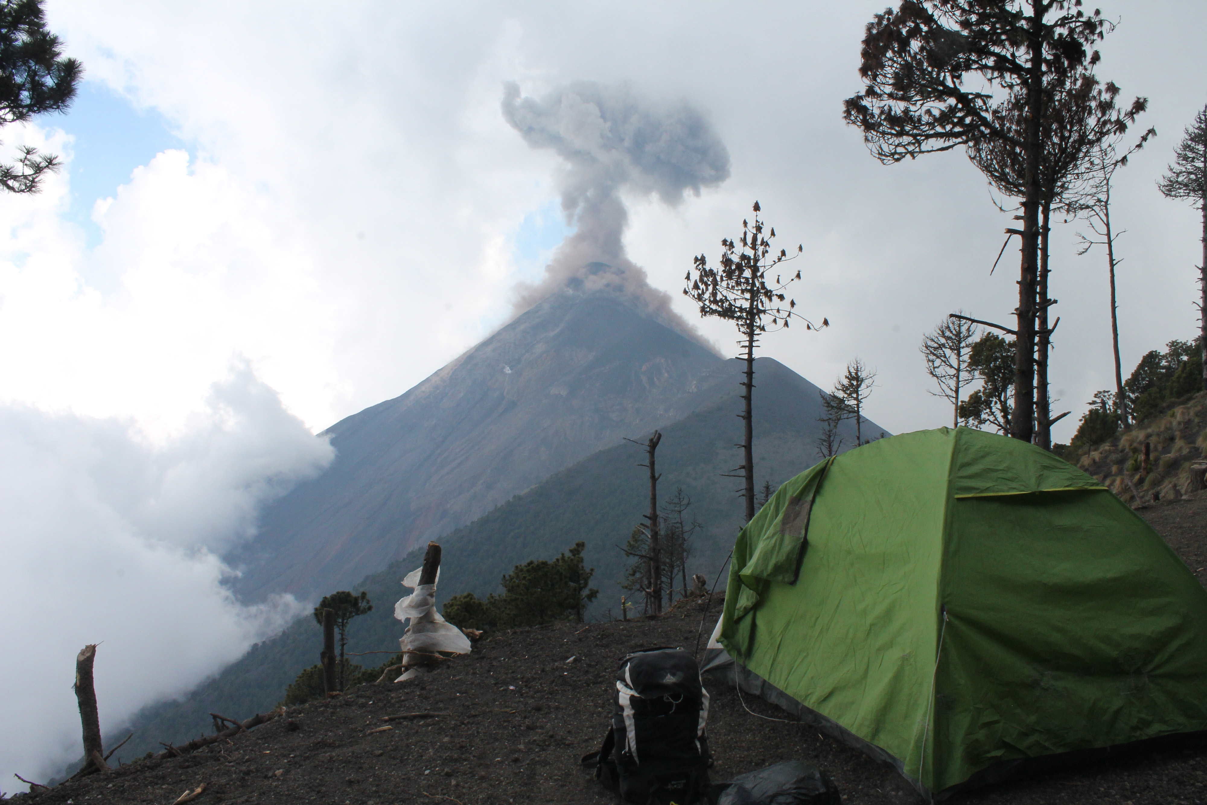 The Aprode campsite on Acatenango overlooks the Volcano of Fire, an active volcano whose peak is at 3,763 metres [Martha Pskowski/Al Jazeera] 