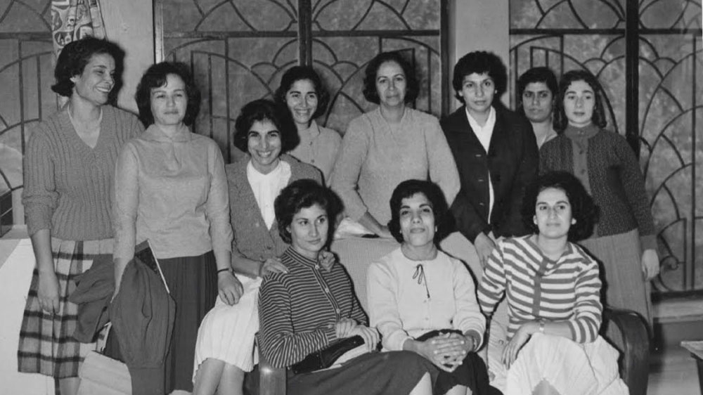 Adib (first row, fifth to the right) and coauthor Firdous al-Mukhtar (second row, first to the right) have been described as the first women to grant Iraqi cuisine its rightful place in history [Courtesy of Naziha Adib]