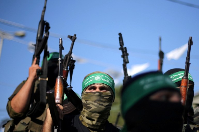 FILE PHOTO: Hamas militants hold weapons as they celebrate the release of Palestinian prisoner Mohammed al-Bashiti, in Rafah, July 2016