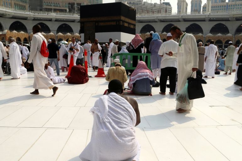 A Muslim pilgrim prays near the Kaaba at the Grand mosque in Mecca