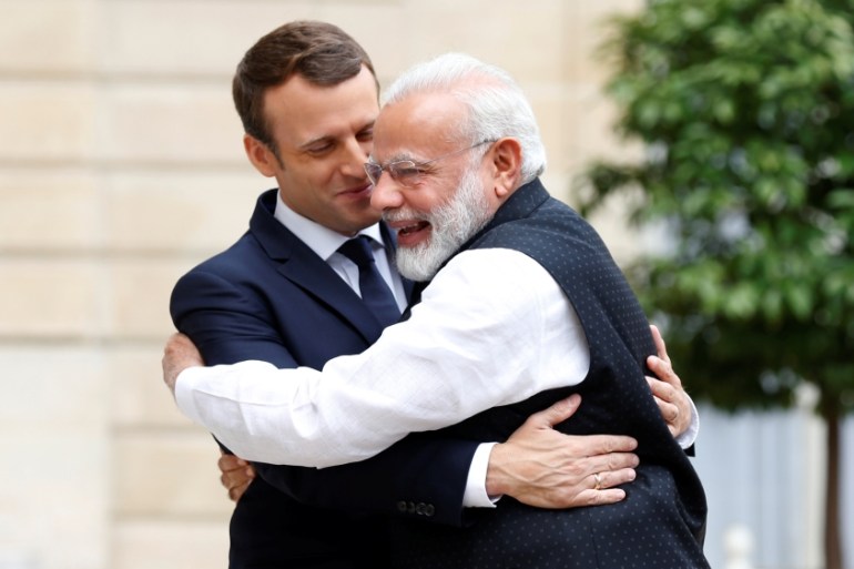 Indian Prime Minister Narendra Modi is greeted by French President Emmanuel Macron on the last leg of his four-nation visit at the Elusee palace in Paris, France