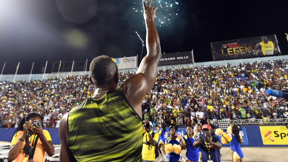 More than 30,000 fans packed the Kingston stadium to watch Bolt's final home soil race [Jewel Samad/AFP]