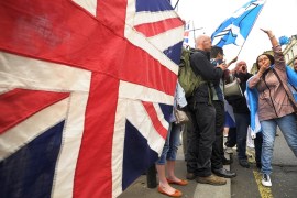 Scotland: Pro-Union supporters hold up a Union flag in reaction to a pro-Independence march through Glasgow