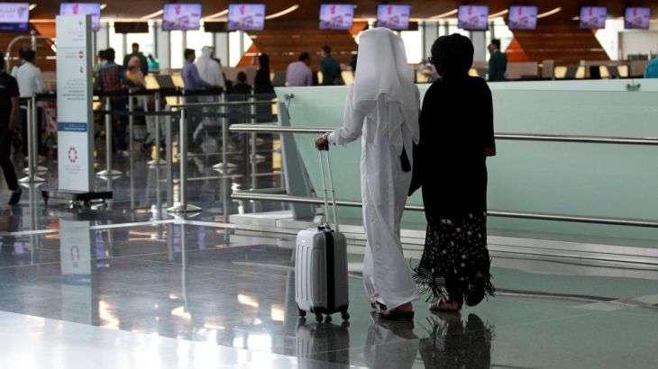 Passengers walk at Hamad International Airport in Doha