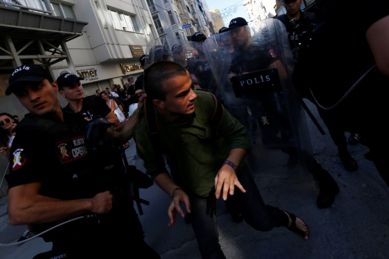 Riot police disperse people as LGBT rights activists try to gather for a pride parade in central Istanbul TURKEY-LGBT/PRIDE Riot police disperse pe
