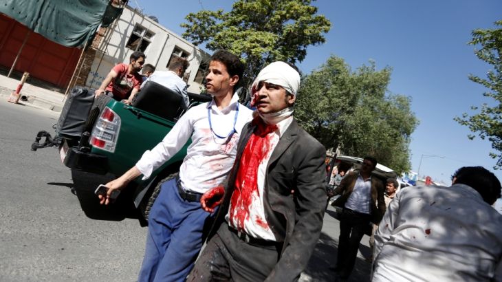 An injured man arrives to a hospital after a blast in Kabul, Afghanistan